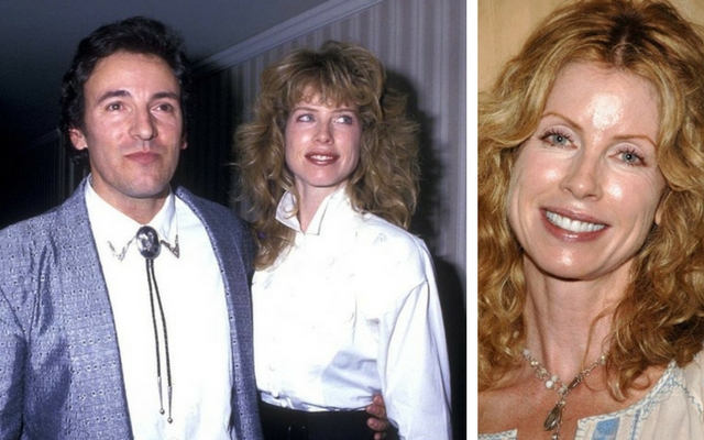 Bruce Springsteen wearing a grey suit with his wife, Juliana Phillips, and Juliana with curly hair smiling at the camera