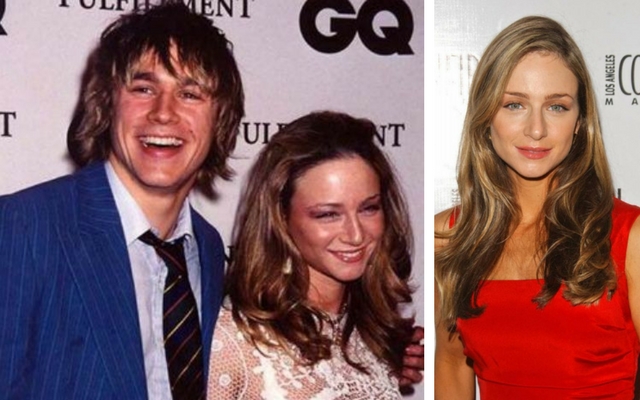 Katharine wearing a white lace top with Charlie Hunnam who is wearing a blue suit, and Katharine wearing a red dress on the red carpet