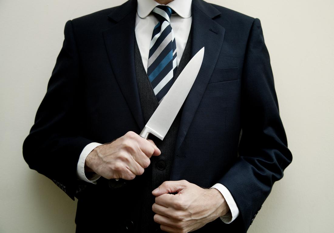 man in suit with knife