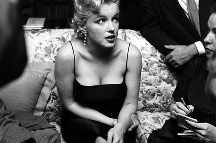 Marilyn Monroe seated