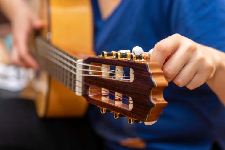 Tuning a Spanish guitar.